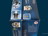 two lego figures that are sitting in a box