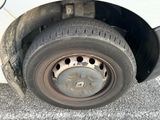 a close up of a flat tire on a car