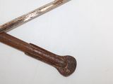 two old rusty hammers on a white surface