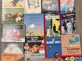 many children ' s books that are on the floor