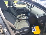 the interior of a car with the door open and the seat up
