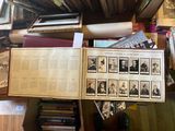 a lot of books on the table with pictures on them