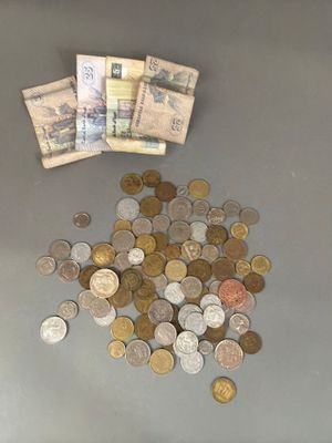 a pile of money sitting on top of a table
