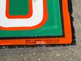 a green and orange sign with a number on it