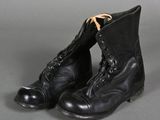 an old pair of black boots with laces on them