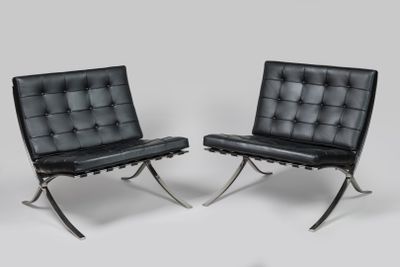 pair of black leather barcelona lounge chairs with chrome legs
