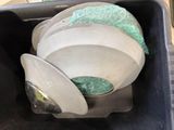 a trash can with a bowl inside of it