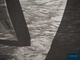 a black and white photo of a boat in the water