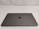 an apple macbook pro laptop sitting on top of a white surface