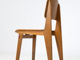 an image of a wooden chair sitting on top of a white floor