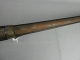 a large metal pipe that is on a white surface