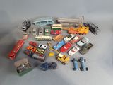 a lot of toy cars and trucks that are on the table