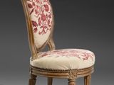 an image of a chair with a floral upholstered back