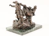 statue of two men on a rock with a dog on a base
