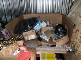 a cardboard box filled with various items in a room