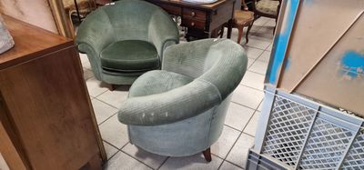 two green chairs and a table in a room
