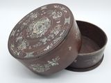 a brown box with a floral design on it