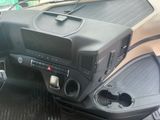 a dashboard of a car with a radio and other items in it