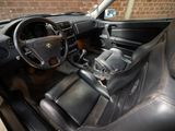 a picture of a car interior with a steering wheel and dashboard