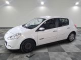 a picture of a small white car parked on a checkered floor