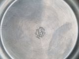 silver plate with the emblem of the united states of america on it