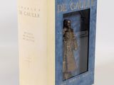 the box is open to show a statue of a man in a coat