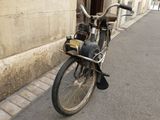 a bicycle parked on the side of the street