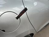 a sticker on the door of a silver car
