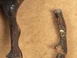 a piece of metal that has been placed next to a piece of wood