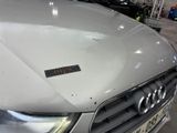 a car that has a sticker on the hood of it