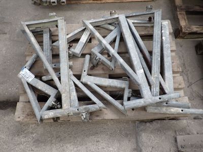 many pieces of metal sitting on top of a pallet