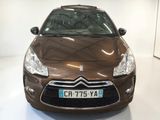 a brown car that is parked in a room
