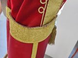 a red umbrella with a gold trim and a red umbrella with a gold trim