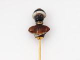 an image of a stick with a figurine on top of it