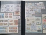 an open book with stamps on it on a table