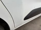 a close up of a white car with a black door handle