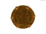 l'image d'une pièce d'or sur laquelle figure le visage d'une femme