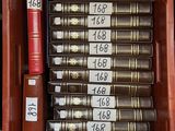 a lot of books that are in a red case