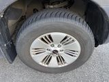 a close up of a car ' s tire on the street
