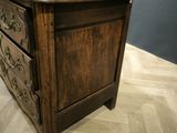 a wooden desk with two drawers on top of it