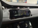 a picture of a car dashboard with a cell phone in it