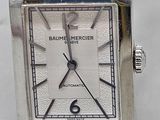 a close up of a wrist watch with a leather band