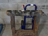 a wooden table with a blue handle and a blue handle on it