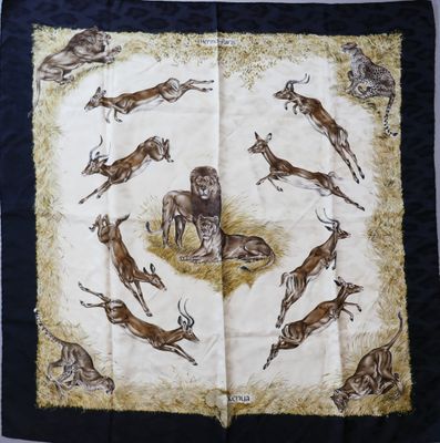 an image of a scarf with a picture of animals on it
