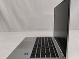 an open laptop computer sitting on top of a white table