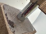 someone is using a knife to cut a piece of wood with a knife