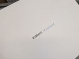 someone holding up a white box with a message on it