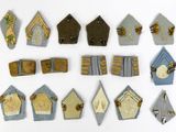 many different types of birdhouses on a white surface
