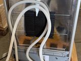 a dog that is sitting inside of an oven