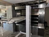 an image of a commercial kitchen with a conveyor belt